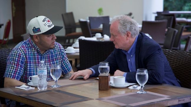 In this photo released by Senator Van Hollen's press office, Hollen, right, speaks with Kilmar Abrego Garcia, a Salvadoran citizen who was living in Maryland and deported to El Salvador by the Trump administration, in a hotel restaurant in San Salvador, El Salvador, Thursday, April 17, 2025. (Press Office Senator Van Hollen, via AP)