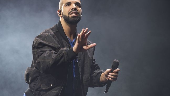 FILE - In this Oct. 8, 2016 file photo, Drake performs onstage in Toronto. Drake's new album “More Life” has broken the U.S. record for the number of streams from a single album in one week. The rapper’s 22-track album recorded 385 million streams across all platforms. (Photo by Arthur Mola/Invision/AP, File)