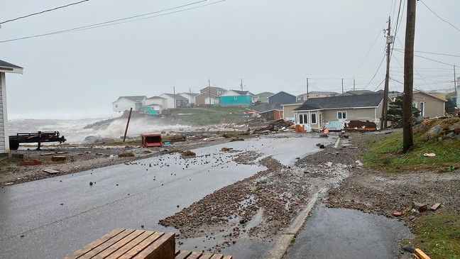 This photo provided by Wreckhouse Press shows damage in Port aux Basques, Newfoundland and Labrador, caused by post Tropical Storm Fiona on Saturday, Sept. 24, 2022. (Rosalyn Roy/Wreckhouse Press via The Canadian Press via AP)